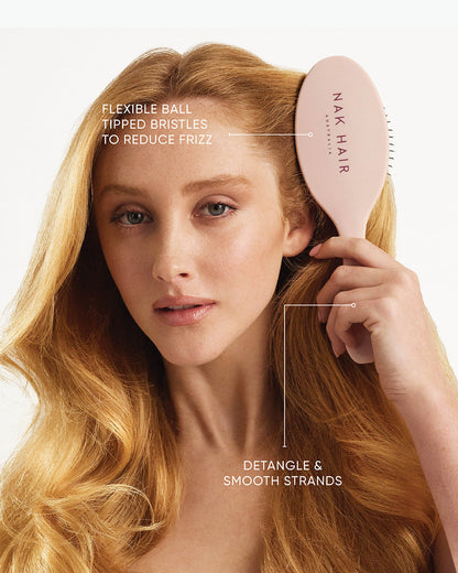 NAK Signature Detangle & Styling Brush in use on wet and dry hair